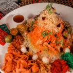 CNY catering featuring a plate of yusheng